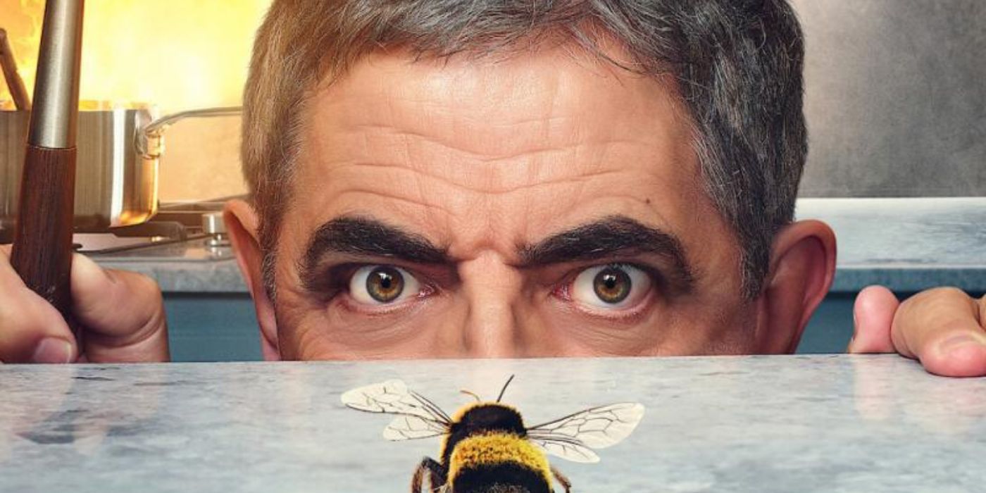 Rowan Atkinson looking at a bee in Man vs Bee