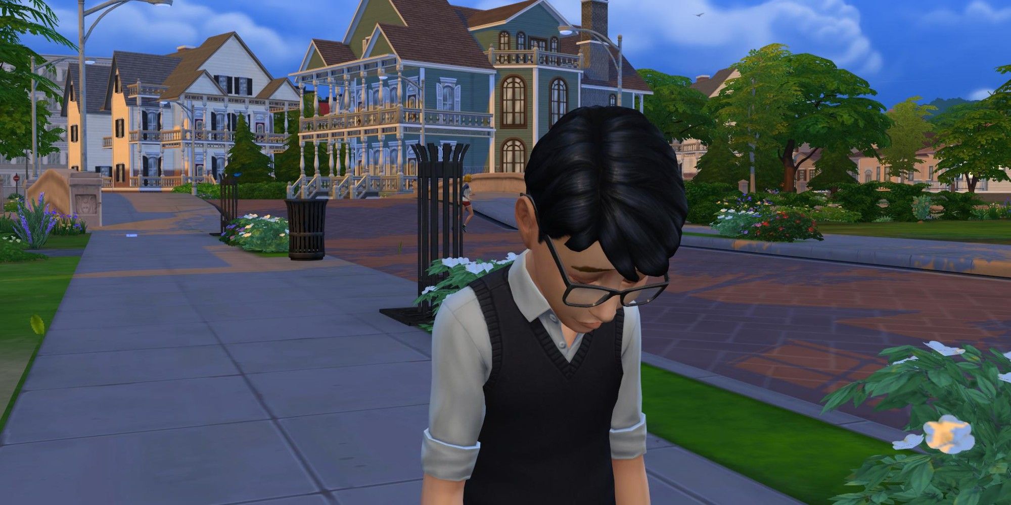 A young Sim from the Sims 4 standing on a sidewalk and looking very sad, with two mansions in the background.