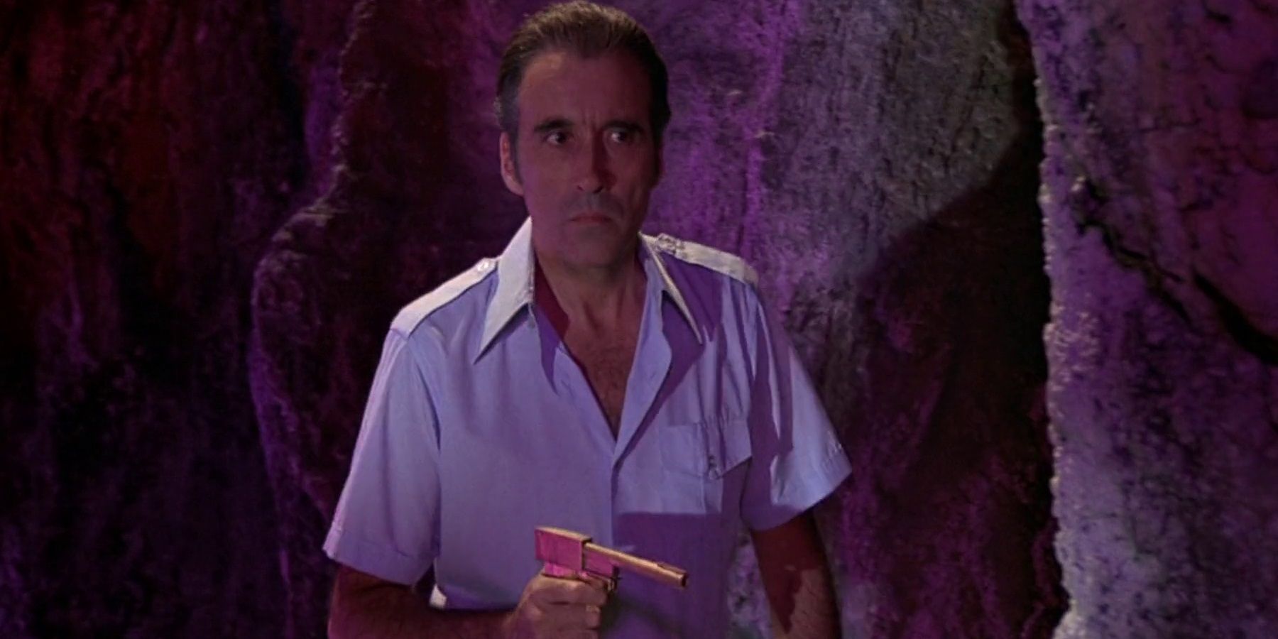 Scaramanga with his golden gun in The Man with the Golden Gun