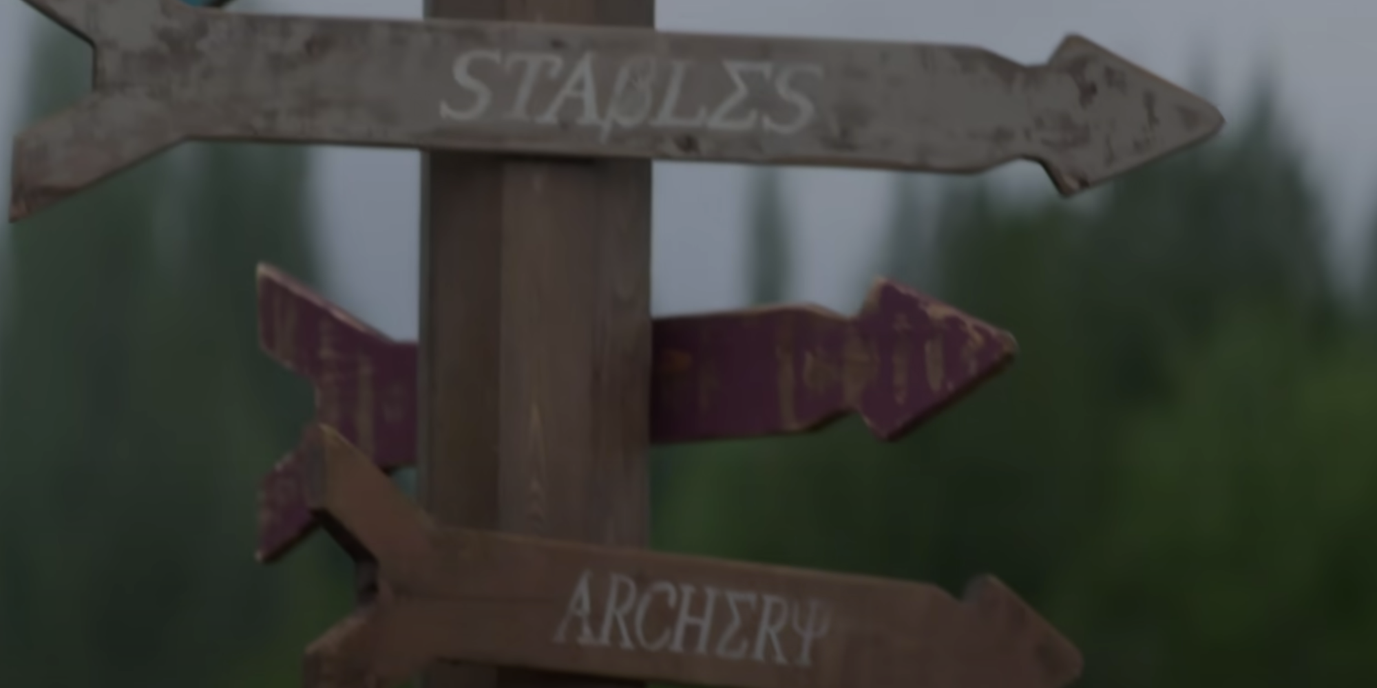 Direction signs for Camp Half-Blood that point to "Stables" and "Archery" with Greek letters interspersed with English ones in Percy Jackson and the Olympians