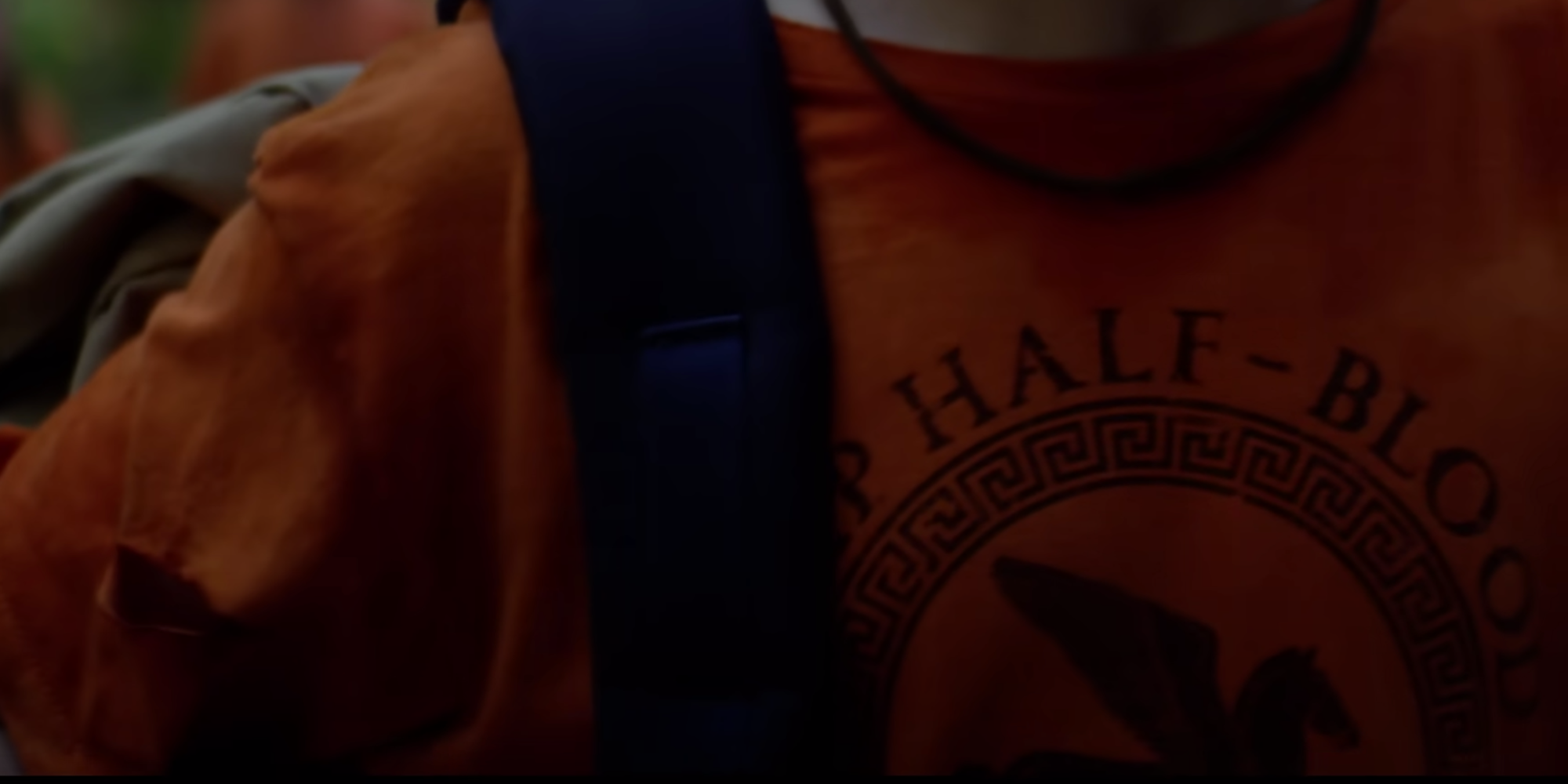 A close-up of Percy's shirt in Percy Jackson and the Olympians
