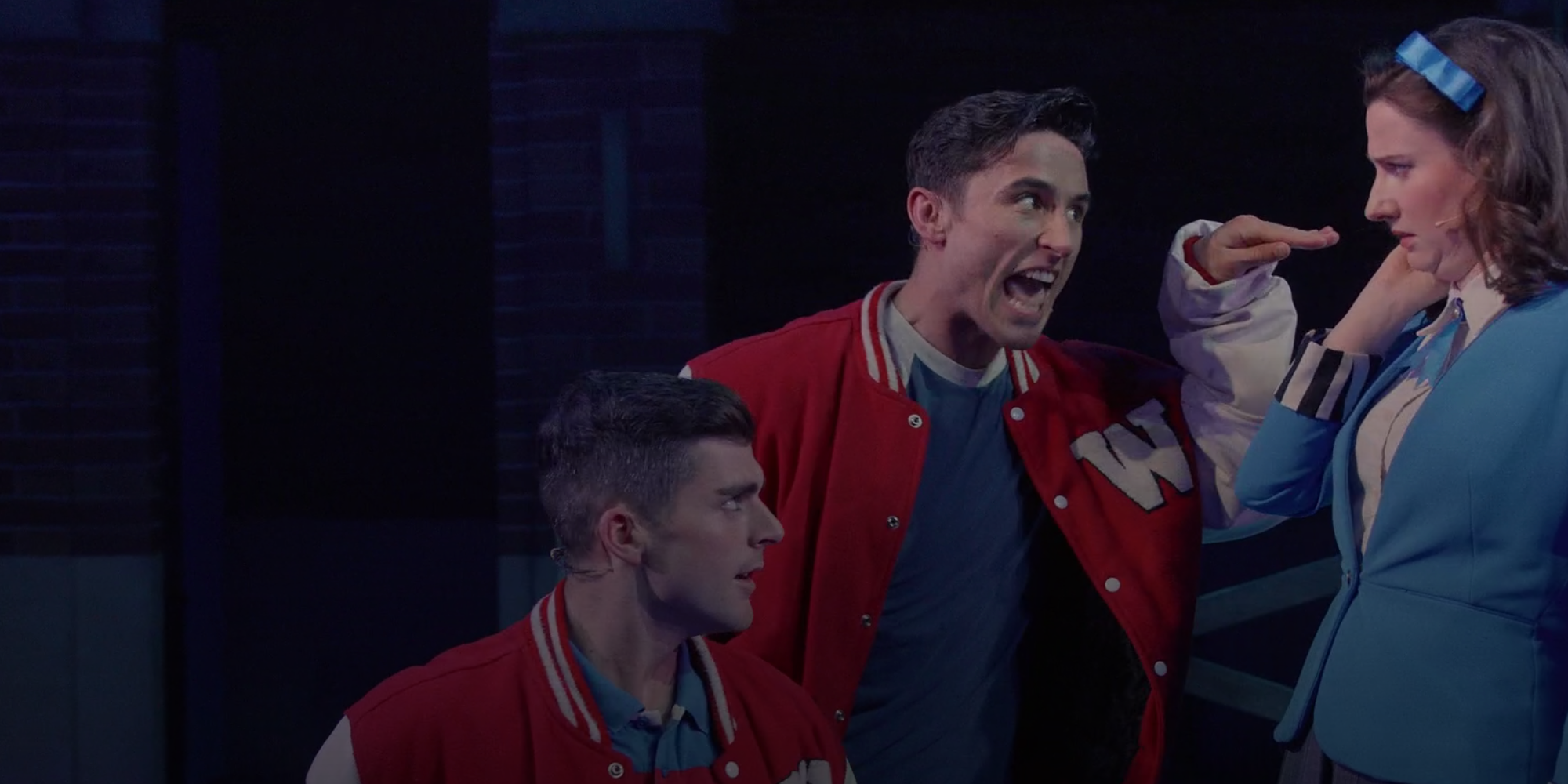 Ram Sweeney and Kurt Kelly aggressively propositioning Veronica in Heathers: The Musical