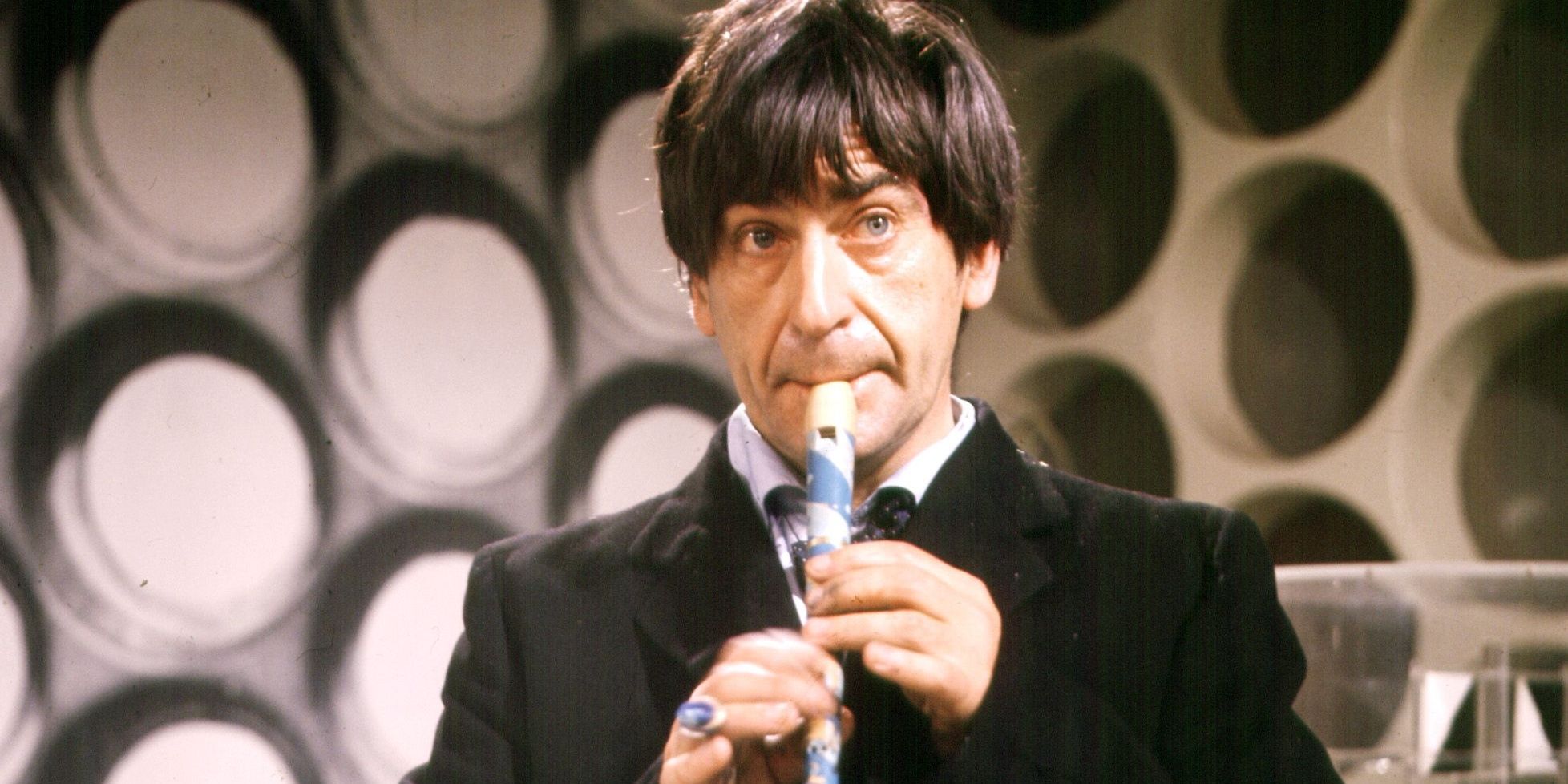 Second Doctor playing the flute in Doctor Who 