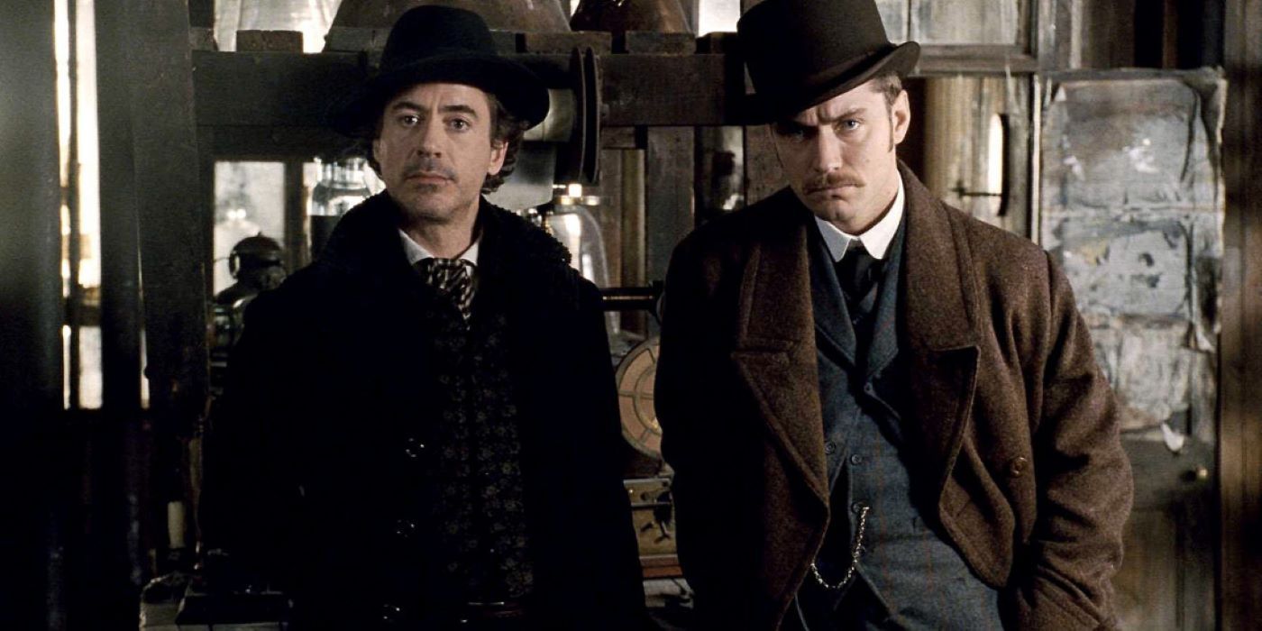 Watson and Sherlock stand side by side in Sherlock Holmes