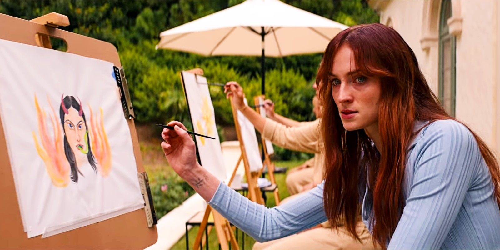 Sophie Turner as Erica Norman in Do Revenge painting a portrait of Drea as the devil