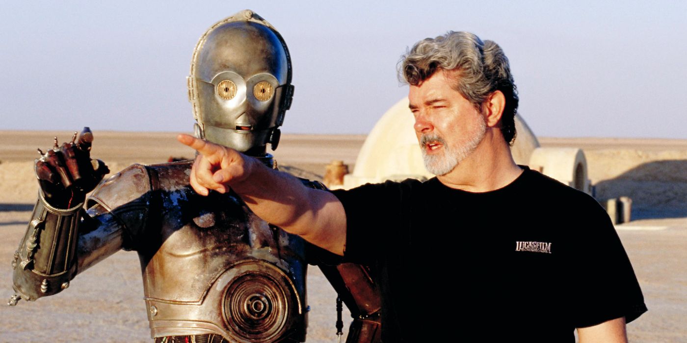 George Lucas pointing with C-3PO on location for Attack of the Clones.