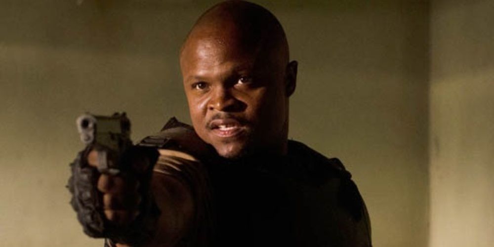 T-Dog aims a gun in The Walking Dead
