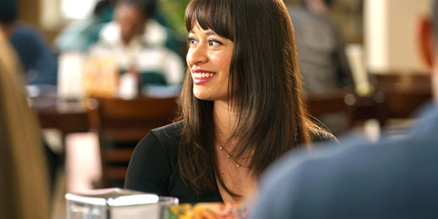 Pippa smiling in the college cafeteria in Tell Me Lies