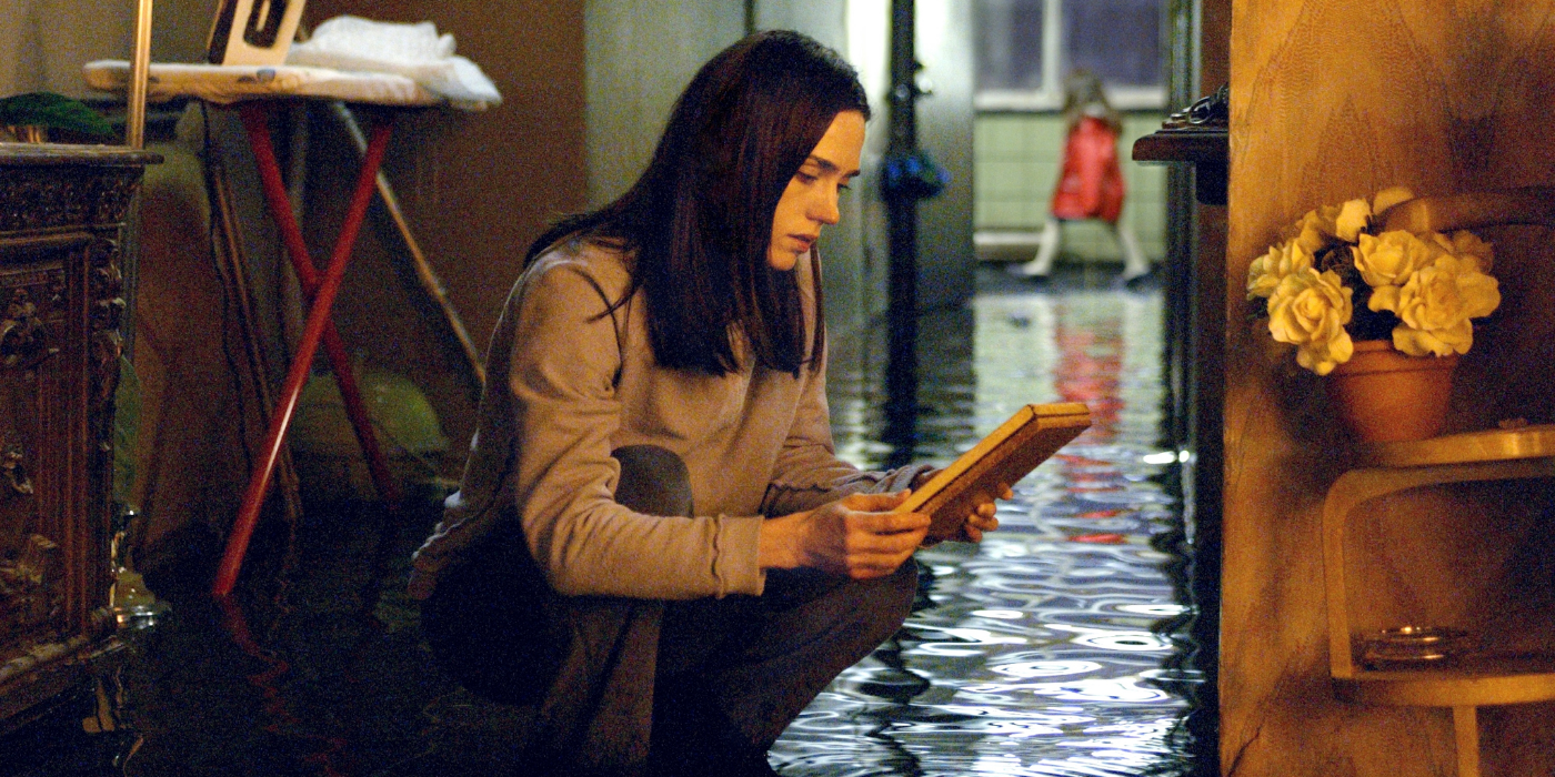 Dahlia kneeling in a flooded apartment in Dark Water