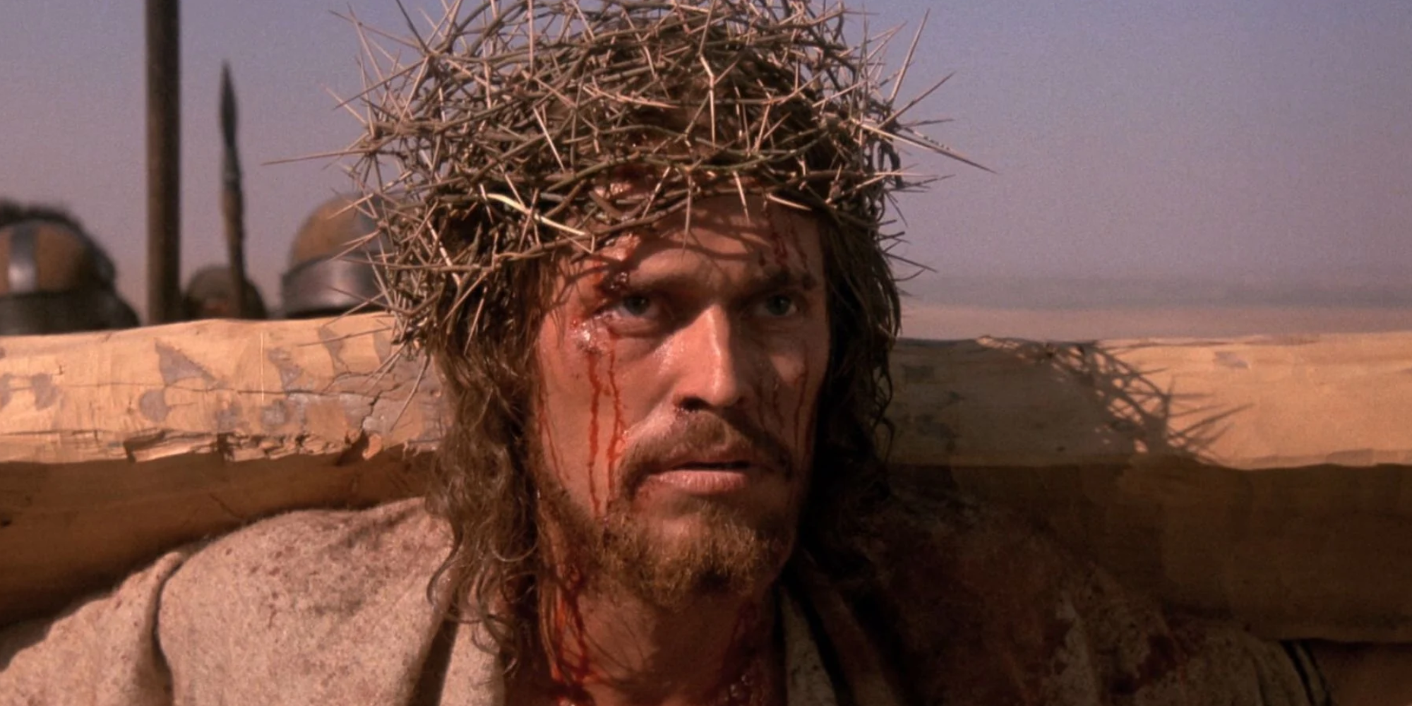 An image of Jesus holding a cross in The Last Temptation Of Christ
