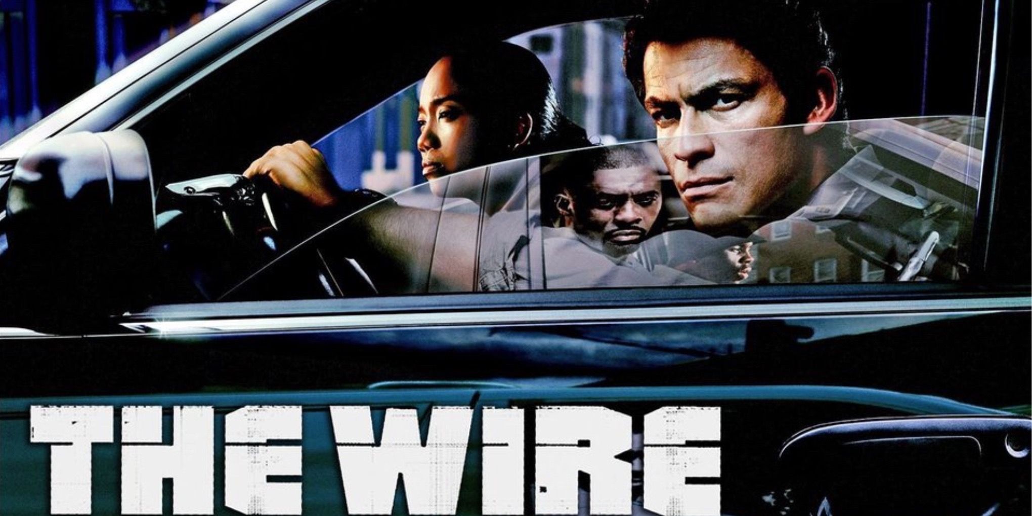 Cops look on from a car in the TV show The Wire