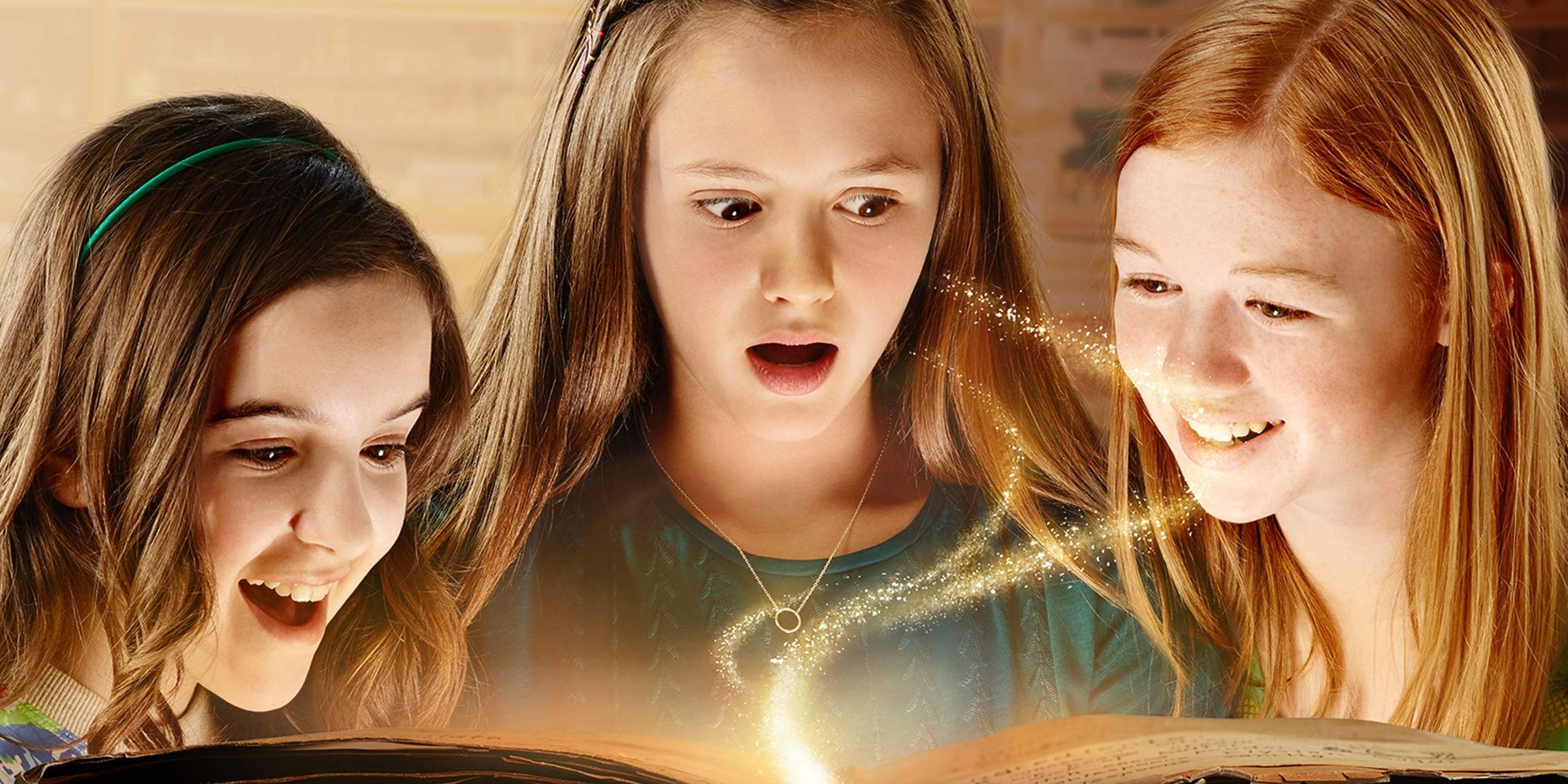 Three girls opening a spellbook in Just Add Magic Cropped