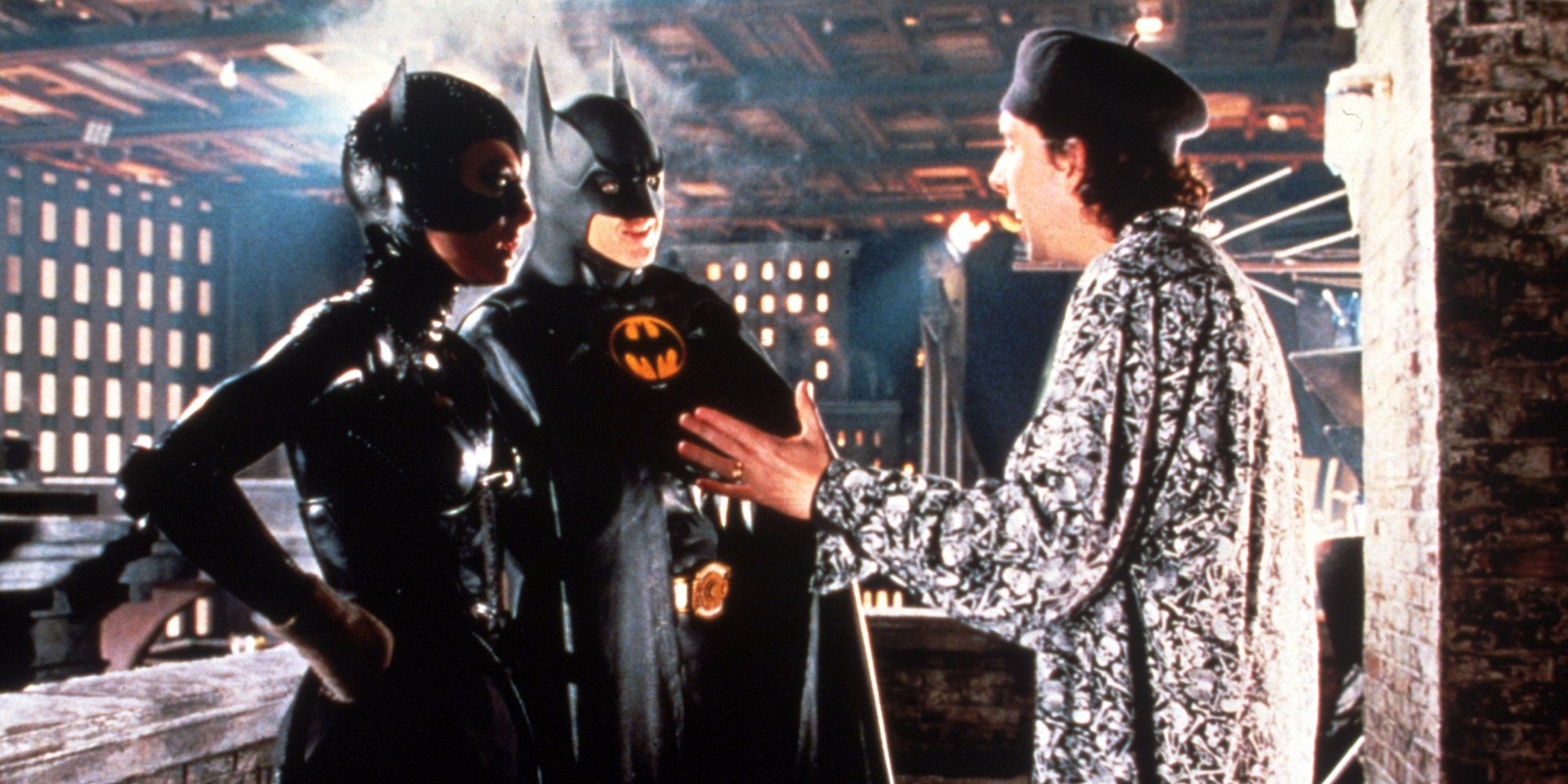 Tim Burton talking to Michael Keaton and Michelle Pfeiffer in costume on the set of Batman Returns
