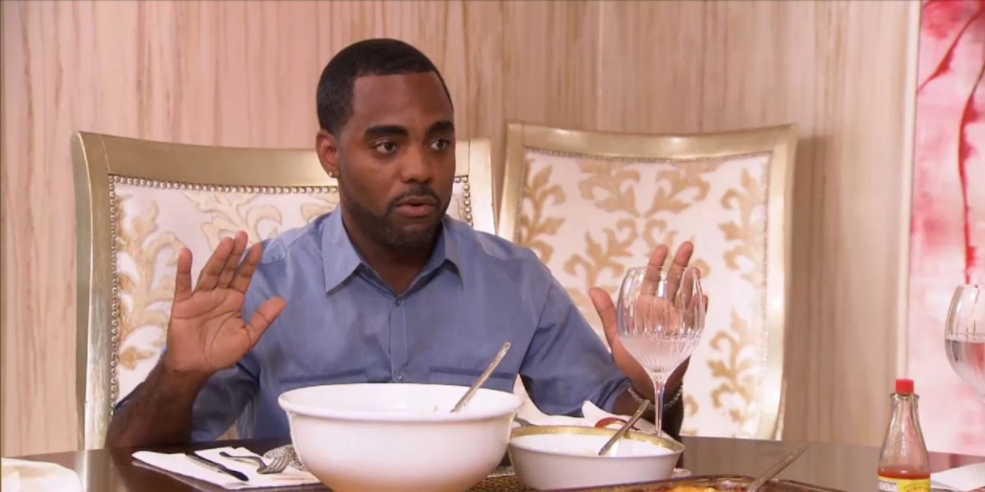 Todd eating dinner and talking to Kandi's mom on RHOA