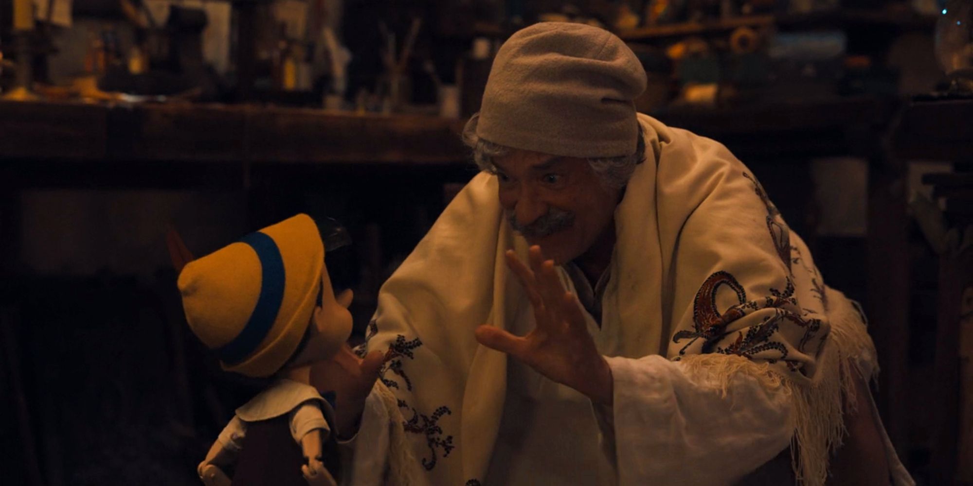 Tom Hanks as Geppetto singing Pinocchio, Pinocchio in the live-action Pinocchio (2022)