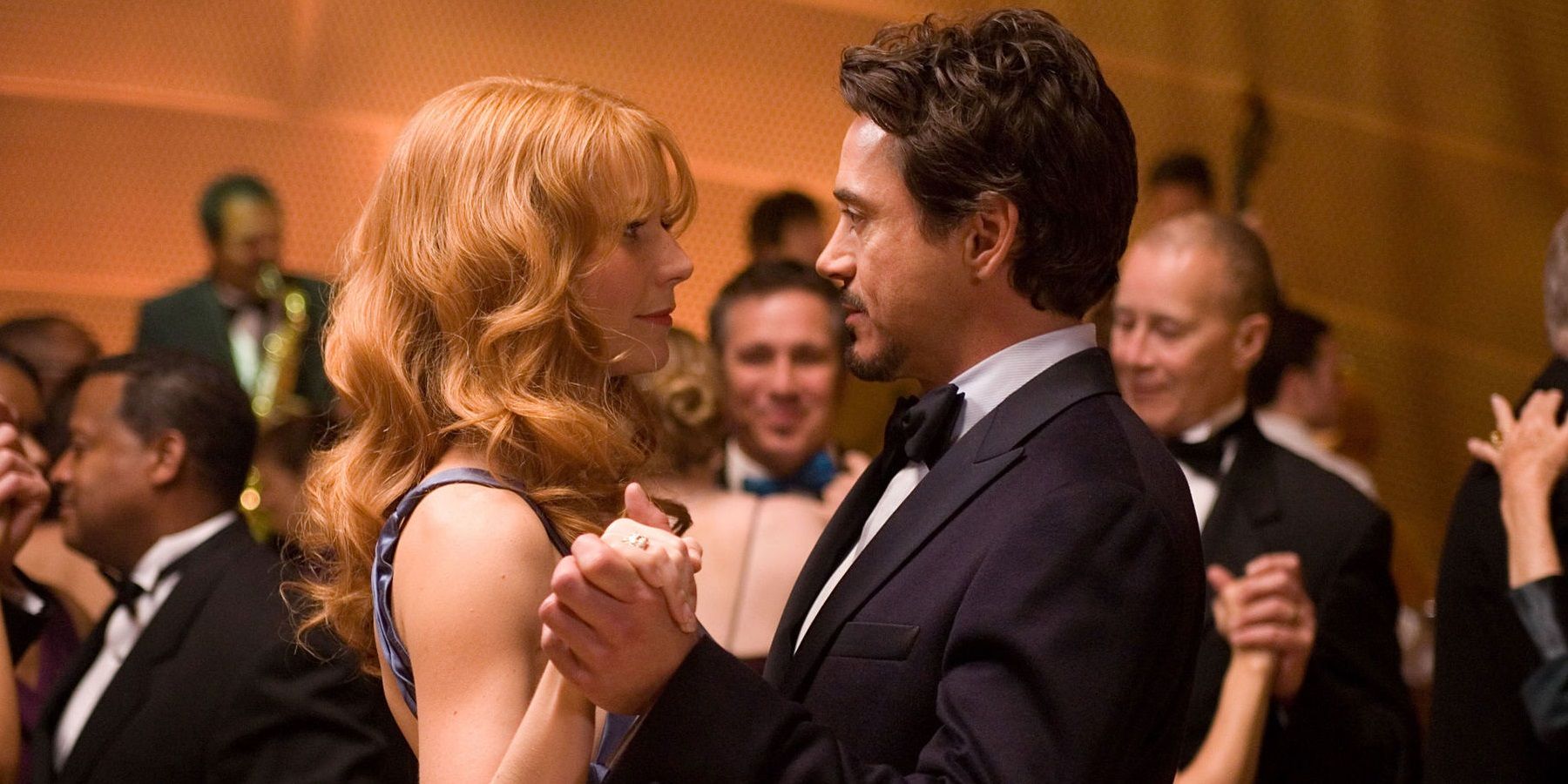 Tony Stark and Pepper Potts dancing in Iron Man