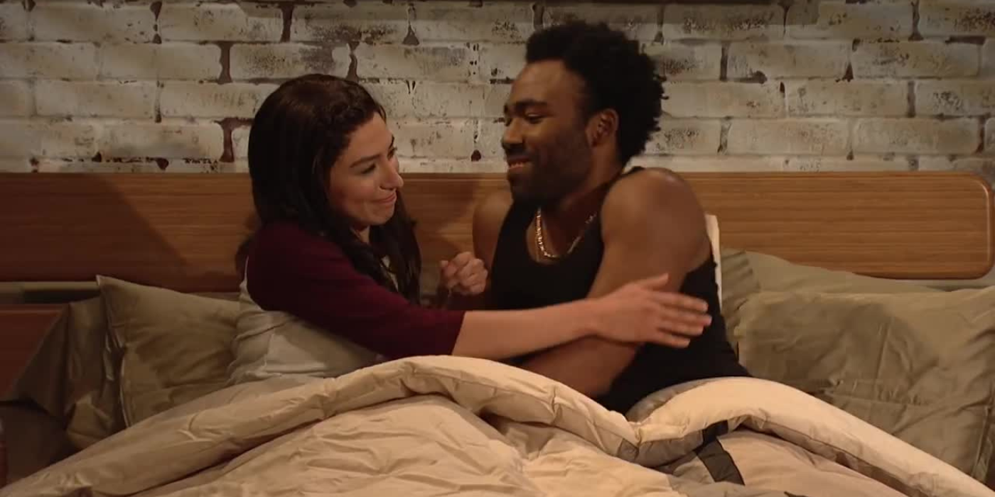 Couple (played by Melissa Villasenor and Donald Glover) ready to be intimate