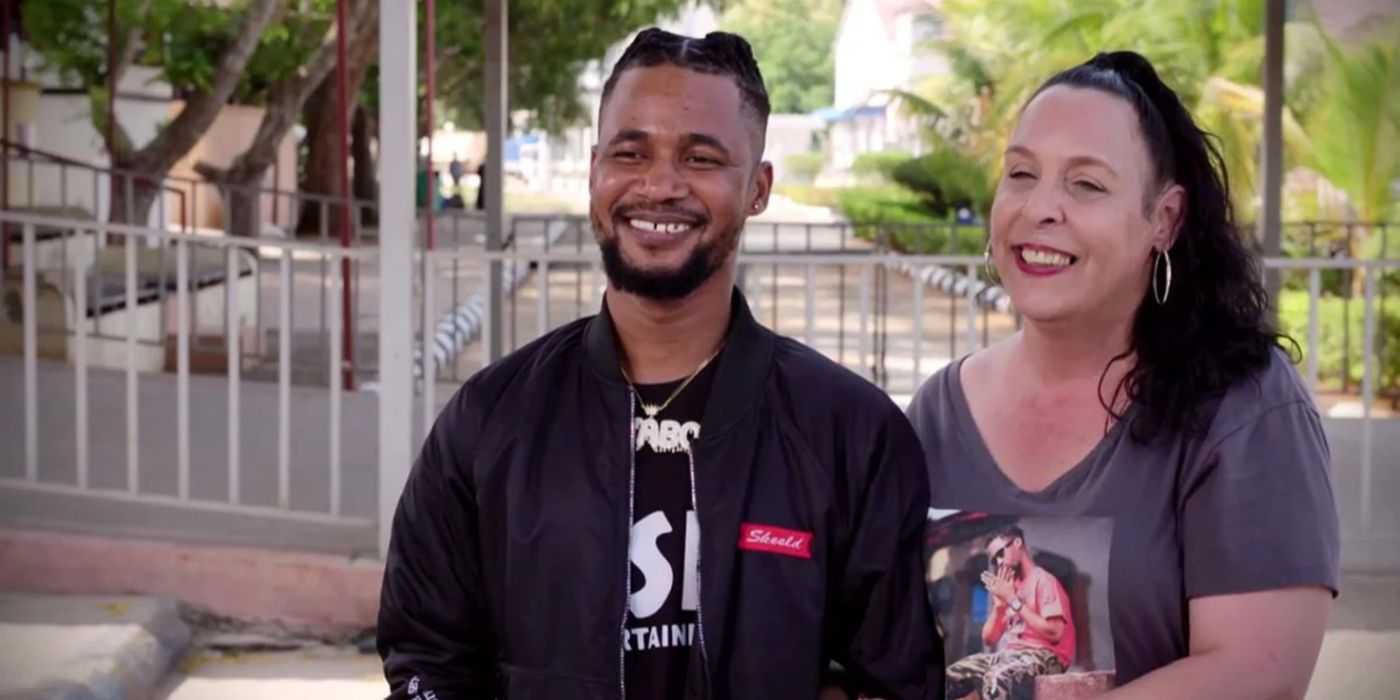 Usman Sojaboy Umar and Kim Menzies smiling on 90 Day Fiancé