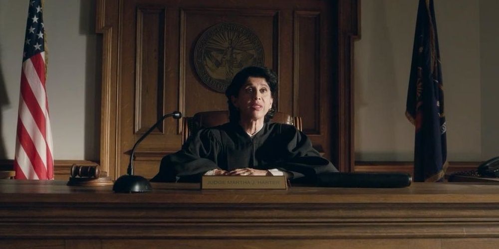Veena Sood sitting at a judge&rsquo;s table in Welcome To Marwen Cropped