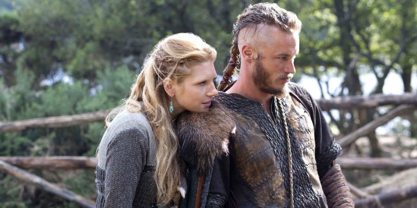 Lagertha rests her chin on Ragnar's shoulder in Vikings.