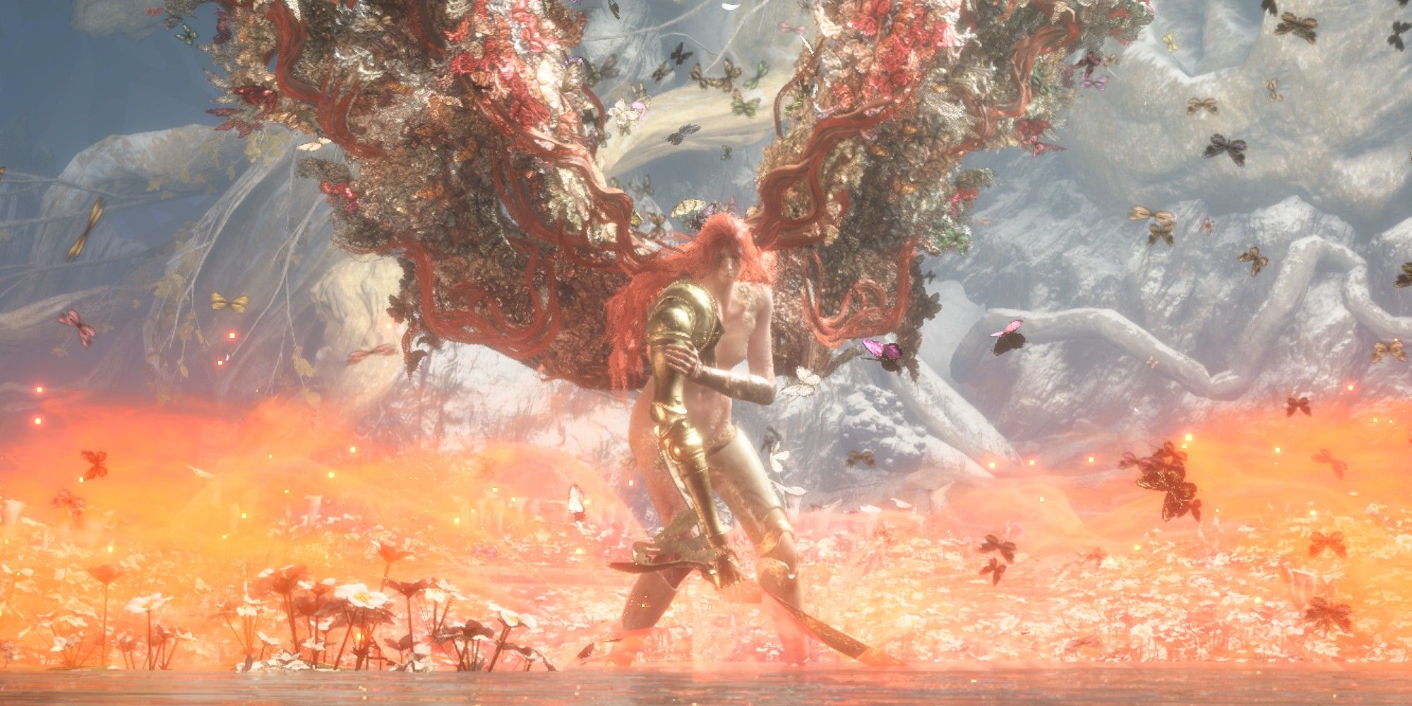 Malenia at the beginning of her second boss fight phase - having just turned into the Goddess of Rot, she has angel-like wings spread, and is surrounded by butterflies and the orange-red glow of the dissipating Scarlet Aeonia.