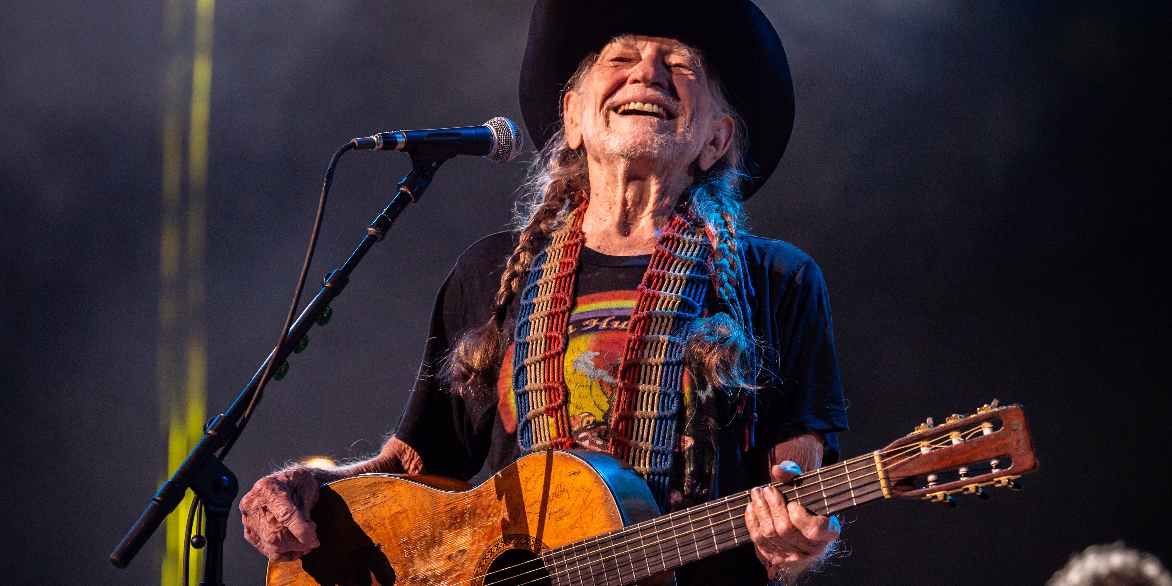 Willie Nelson playing the guitar Cropped