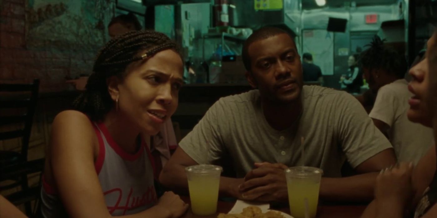 Zora Howard and Joshua Boone sitting on a table in Premature (1)