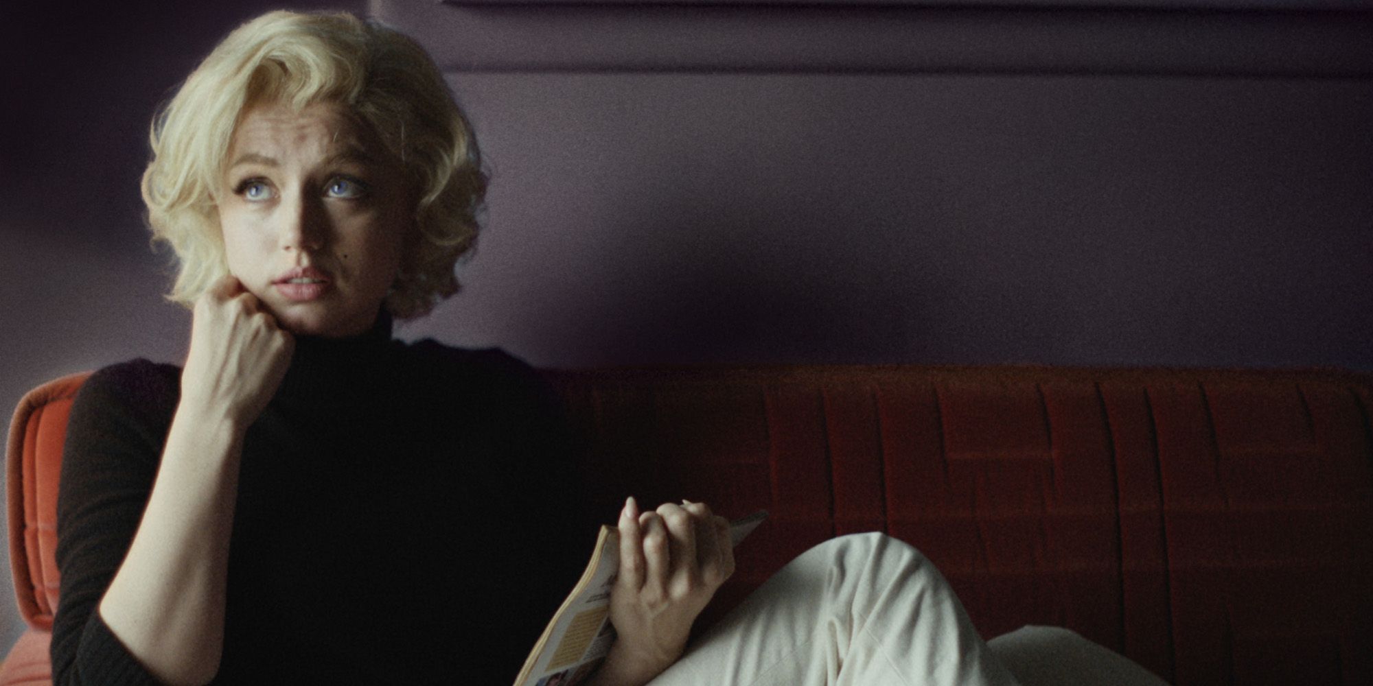 Ana de Armas as Marilyn Monroe on a sofa in Blonde