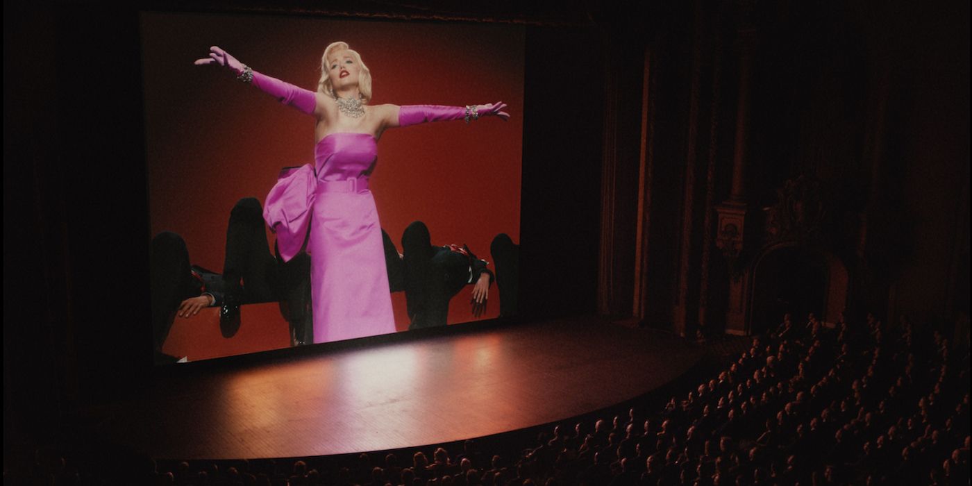 Ana de Armas in a pink dress in a recreated movie scene in Blonde
