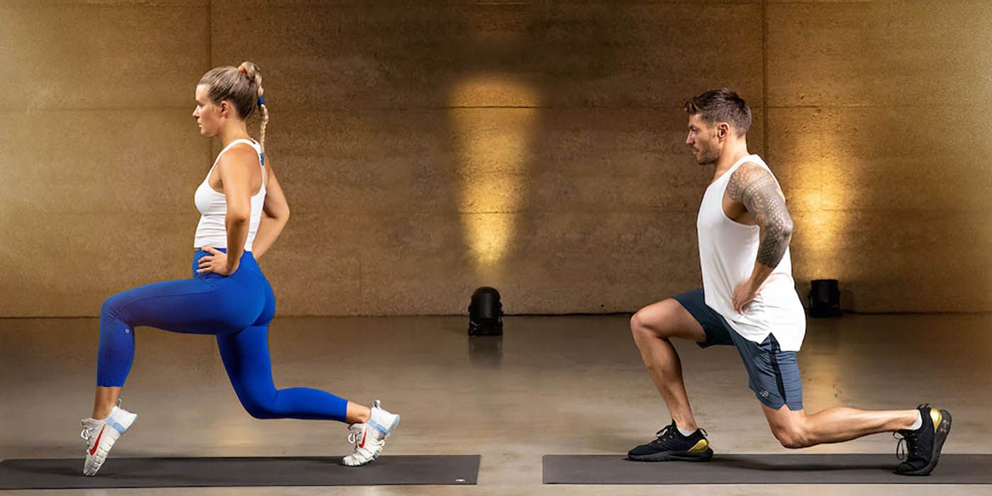A side view of a woman and man doing lunges on workout mats from the Centr app