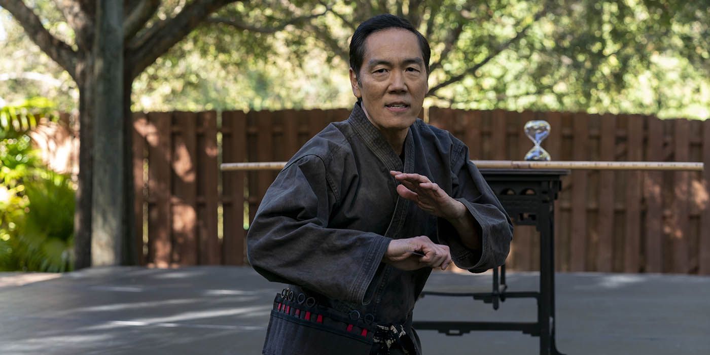 Chozen wearing his gi, in a fighting stance in a scene from Cobra Kai