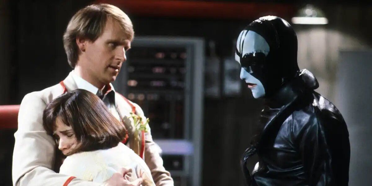 The FIfth Doctor holds Peri