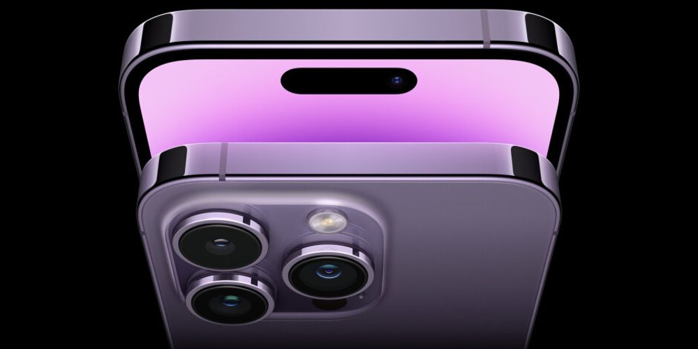 The iPhone 14 Dynamic Island is displayed in purple