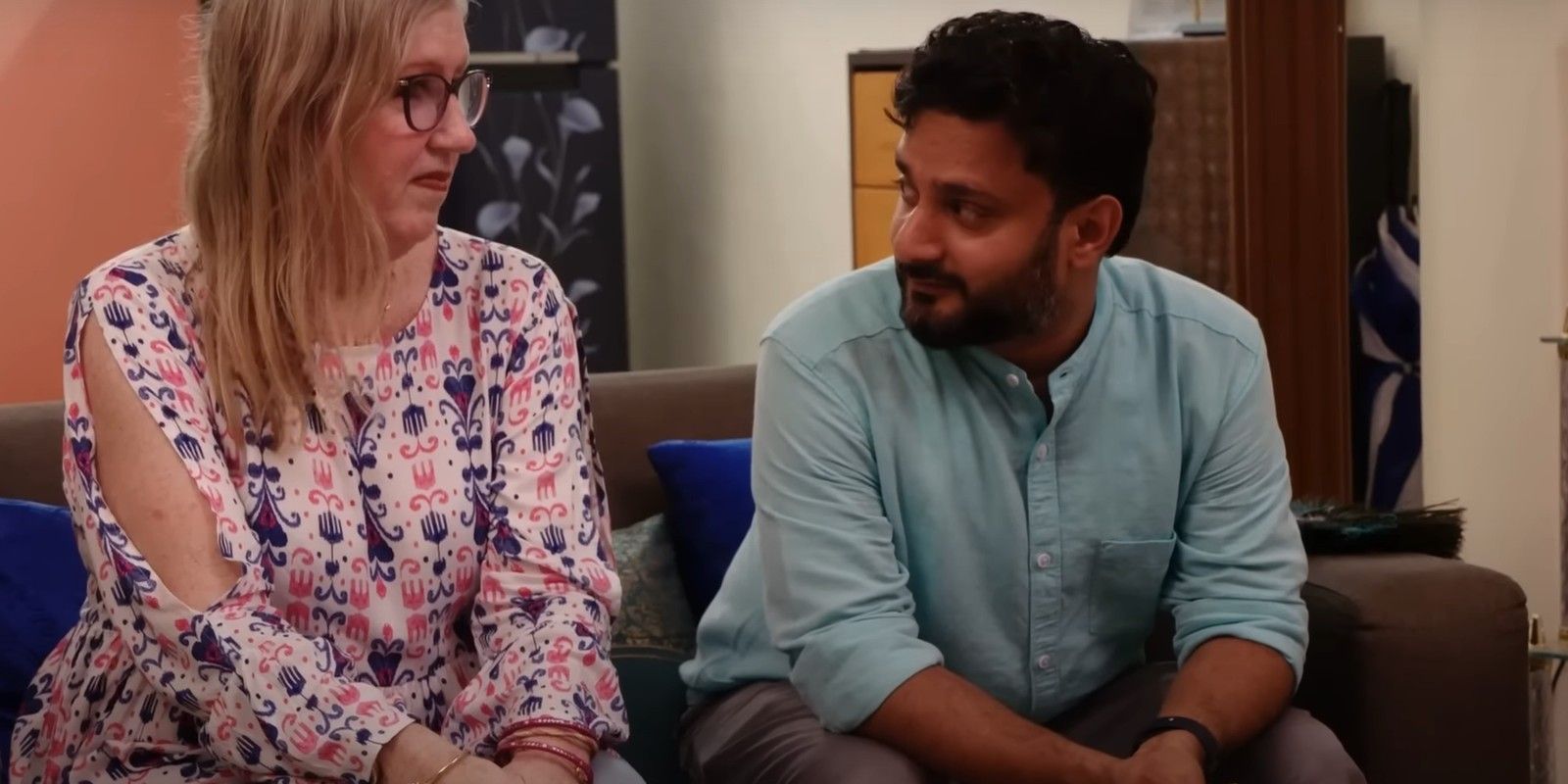 Jenny Slatten and Sumit Singh from 90 Day Fiancé talking on couch