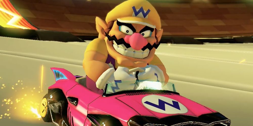 Wario drifts around a corner in Mario Kart 8