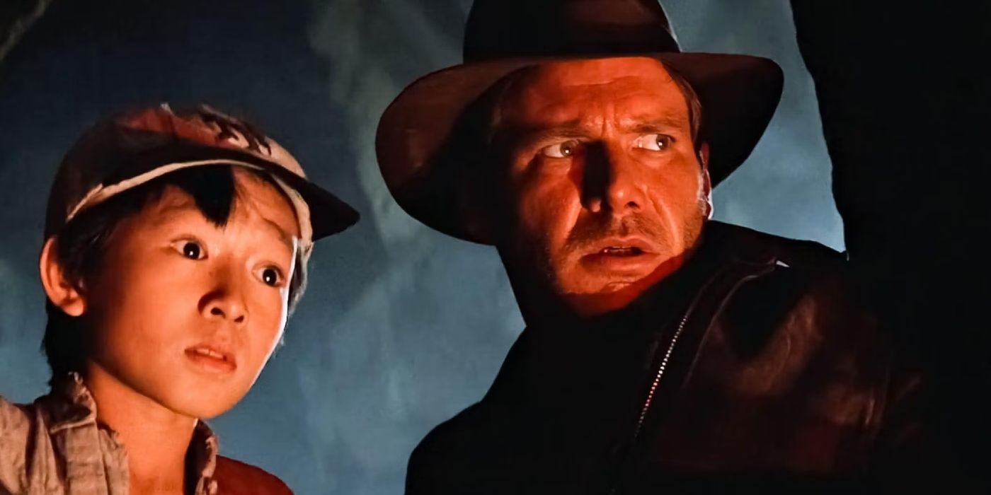 Short Round and Indiana Jones look worried in Indiana Jones and the Temple of Doom.