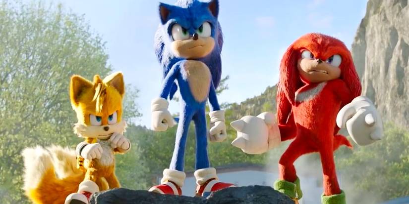 sonic, tails, and knuckles standing together outside