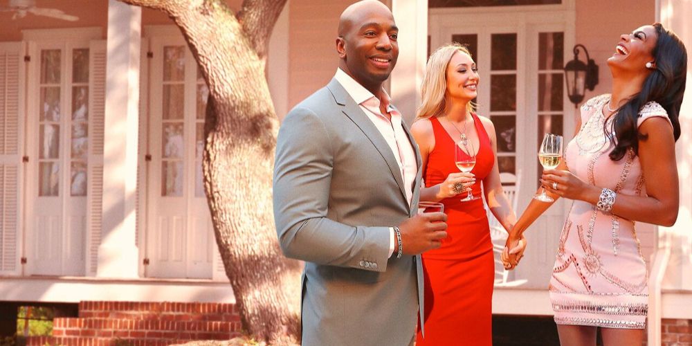 The cast of Southern Charm: New Orleans drinks Champaign on the patio