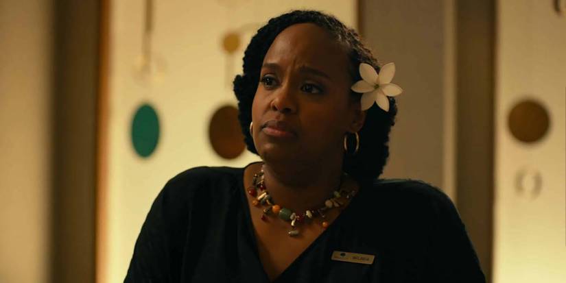 Belinda looks on with a concerned look on her face in The White Lotus