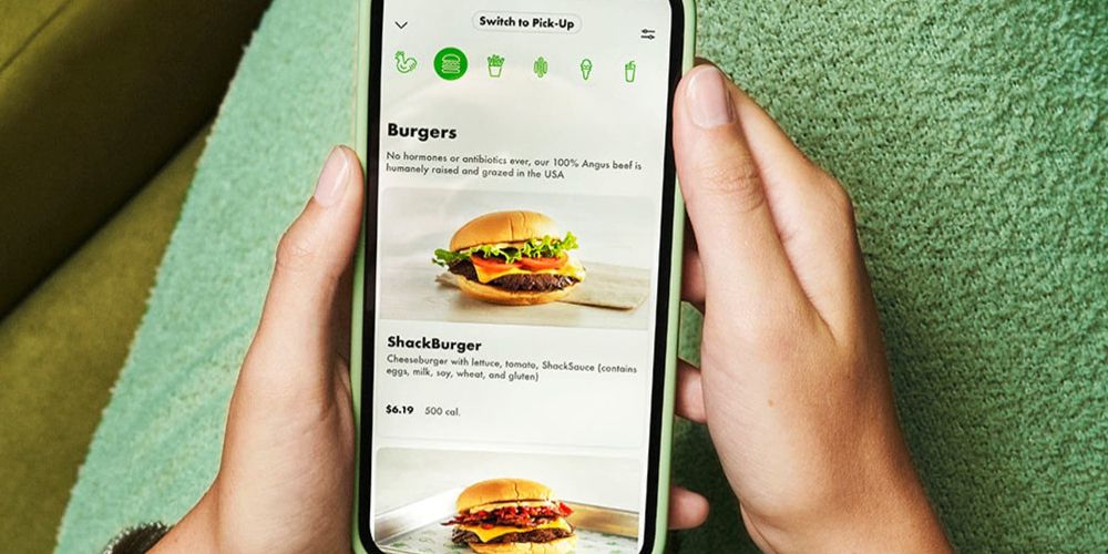 A user looks at an Uber Eats menu on their phone