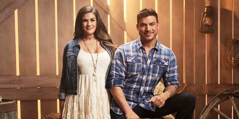 Brittany and Jax pose together in a barn for Vanderpump Rules: Jax and Brittany Take Kentucky