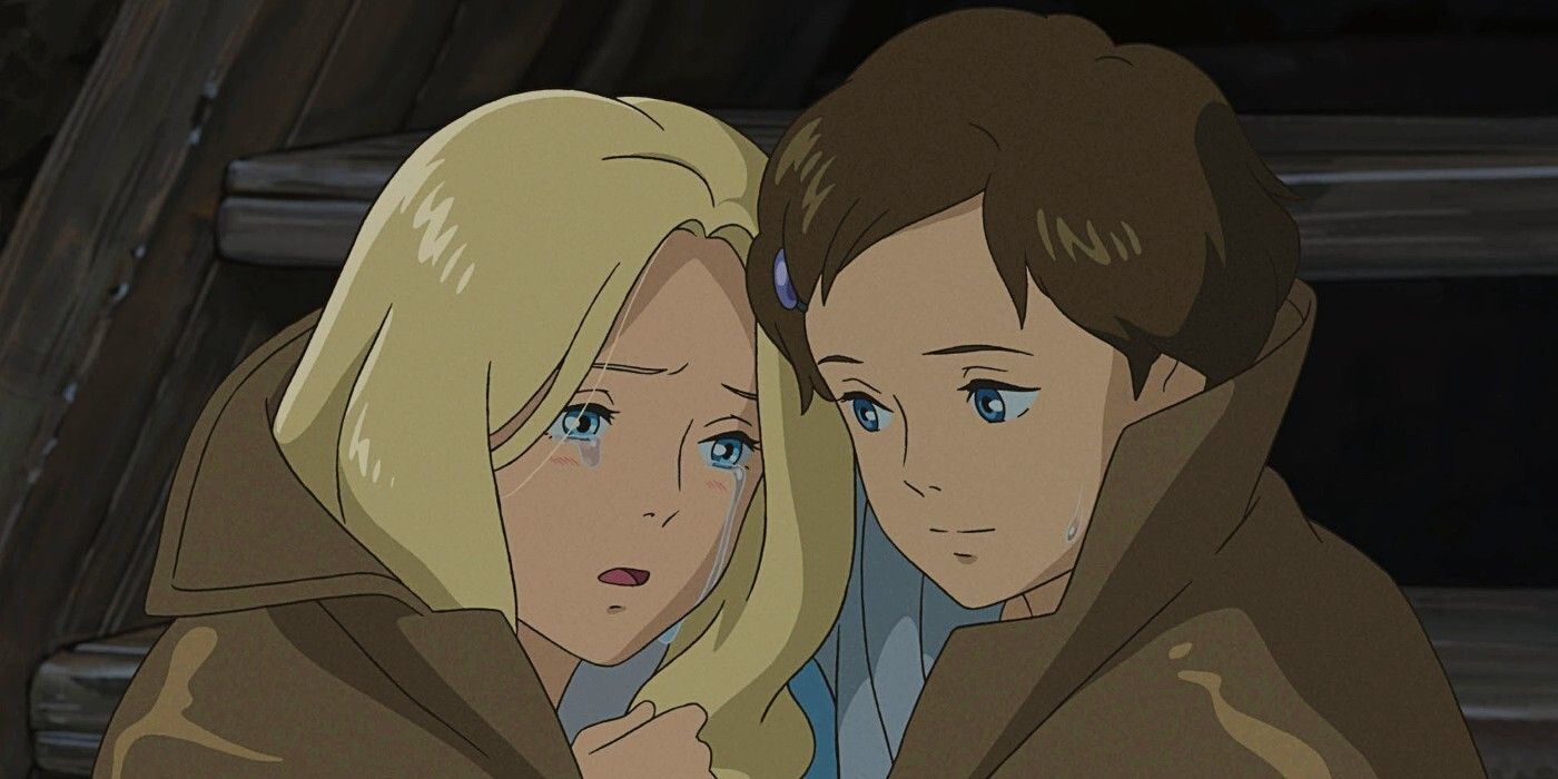 Two young girls console each other in the film When Marnie Was There 