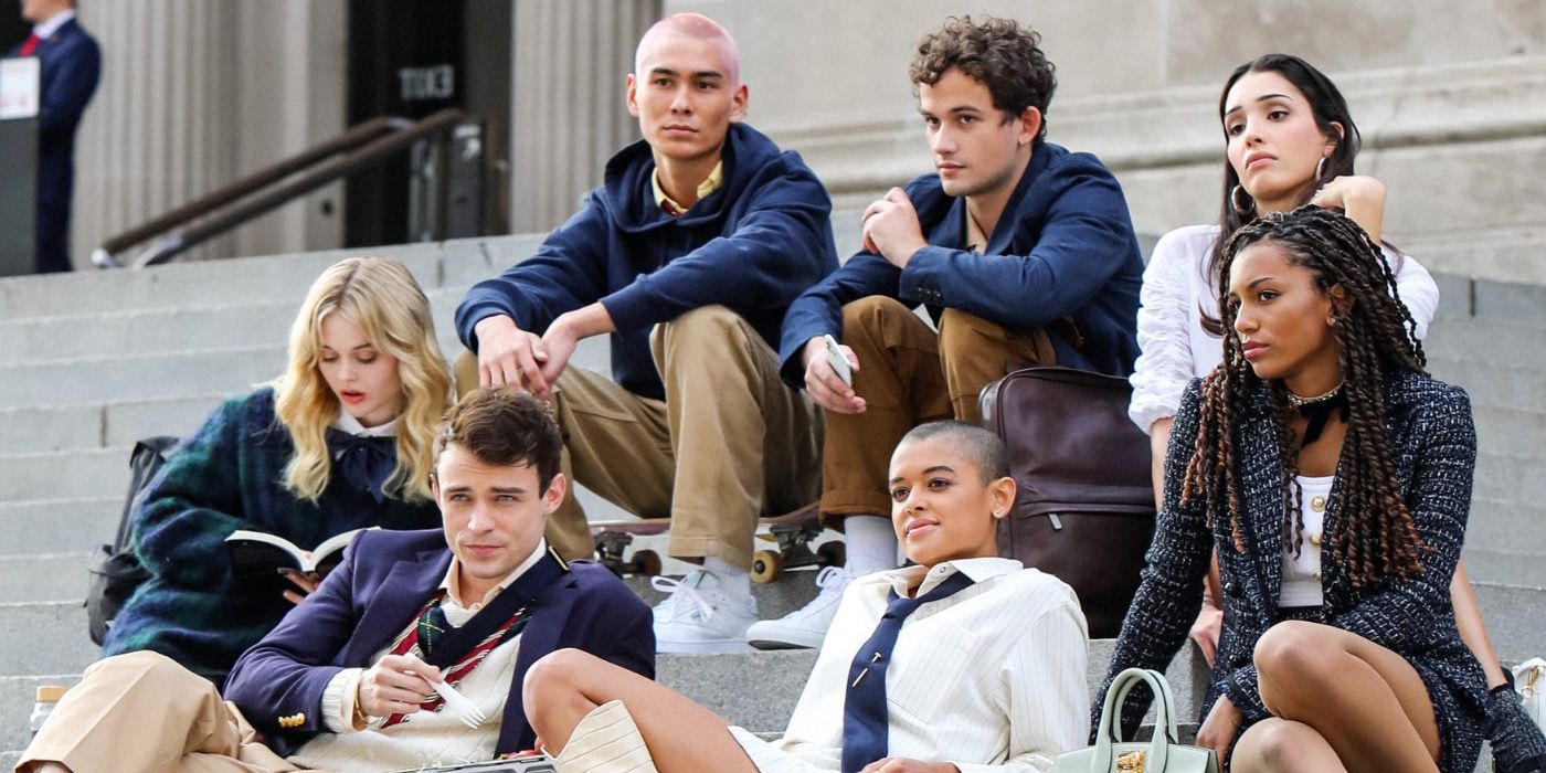 The cast of the Gossip Girl reboot sits on the steps together.
