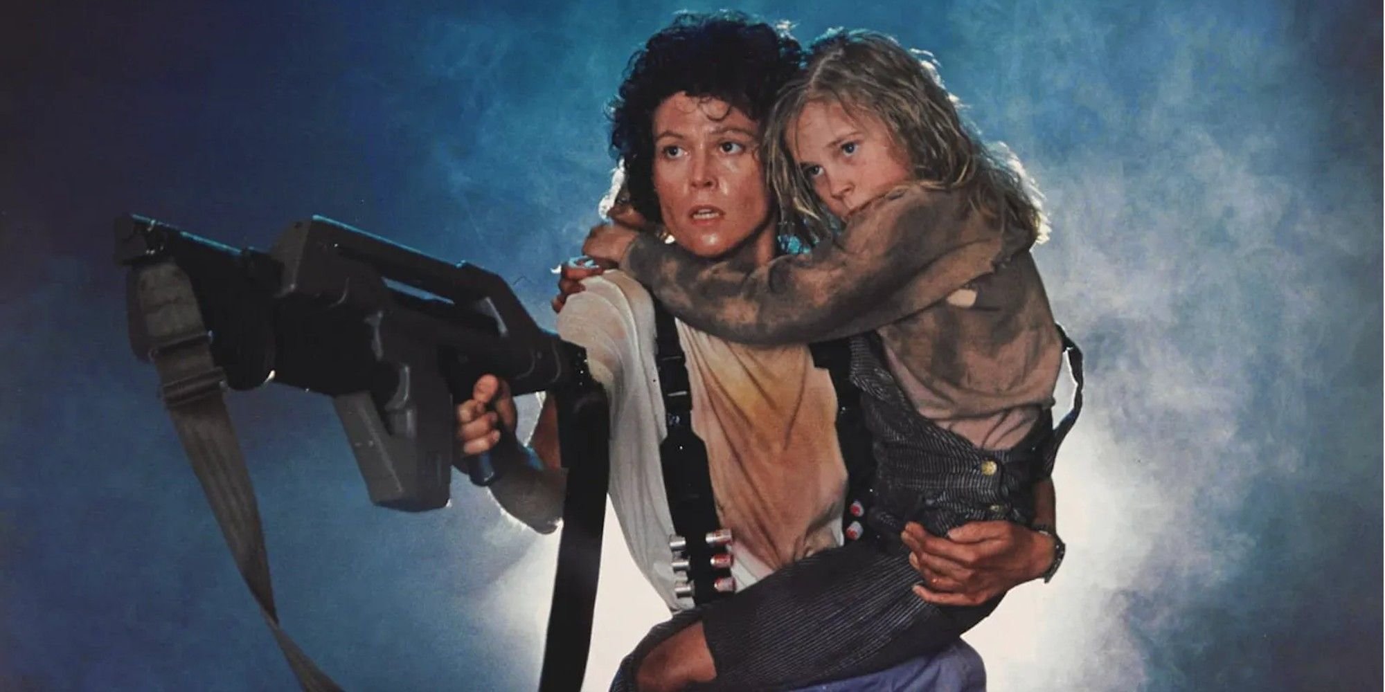 Ripley carrying Newt and holding a gun in Aliens