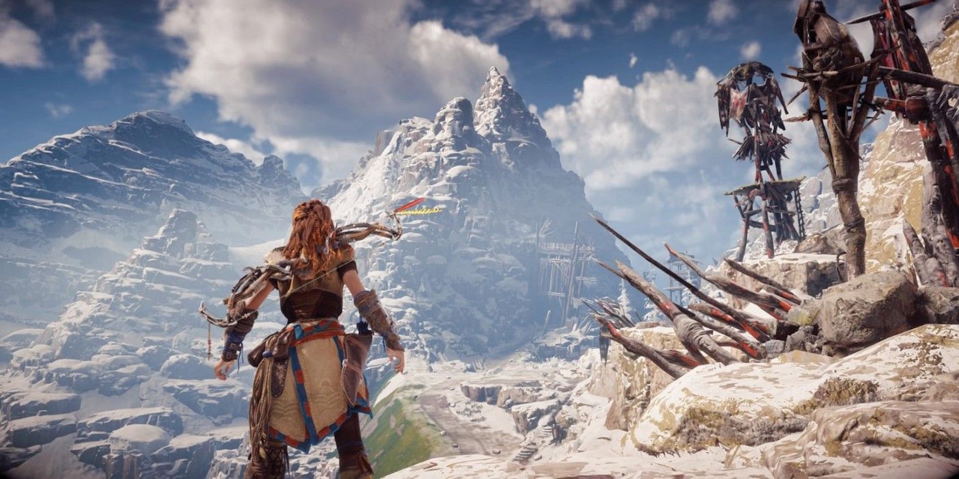 An image of Aloy looking at some mountains in Horizon Zero Dawn. 