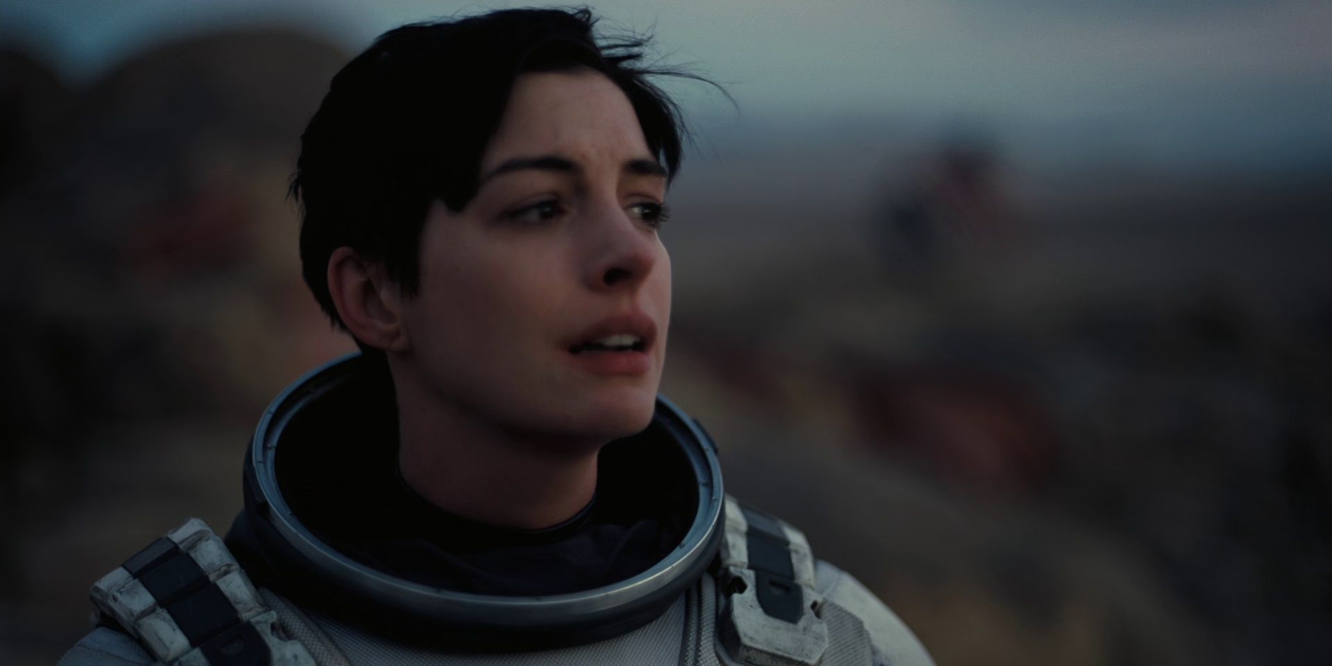 Anne Hathaway looks on in tears at the end of Interstellar