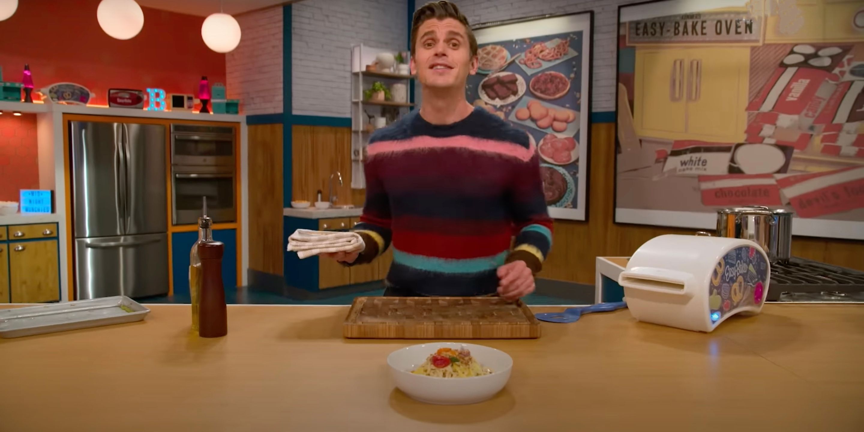 Antoni Porowski presents a dish on the set of Easy Bake Battle.