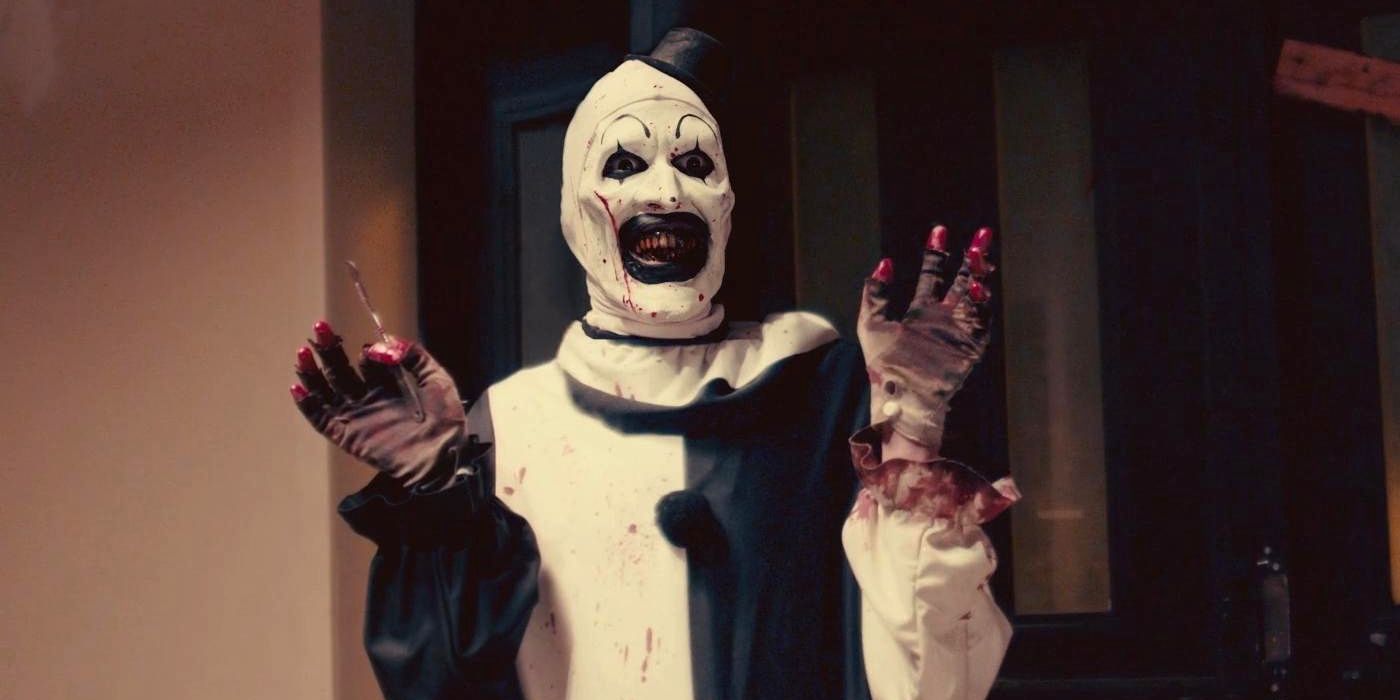 Art the Clown holds up his hands in Terrifier 2