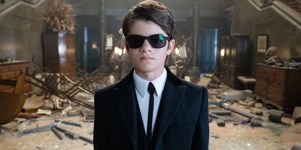Artemis Fowl wearing a suit and sunglasses