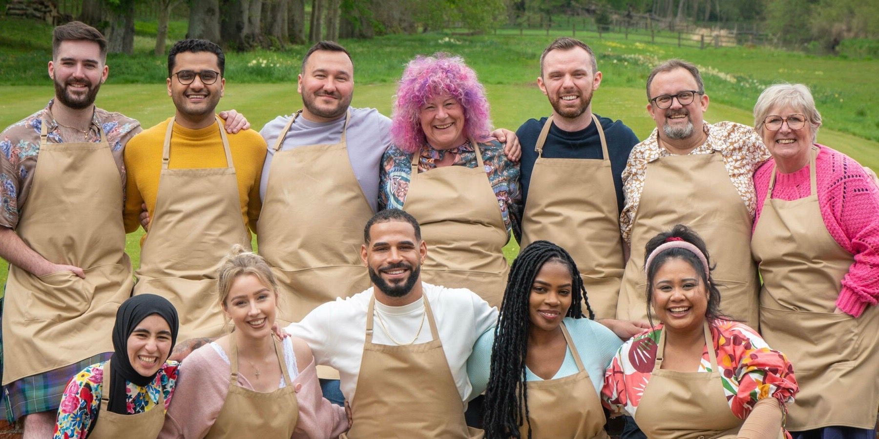 The Great British Baking Show Season 13 Cast group shot with aprons